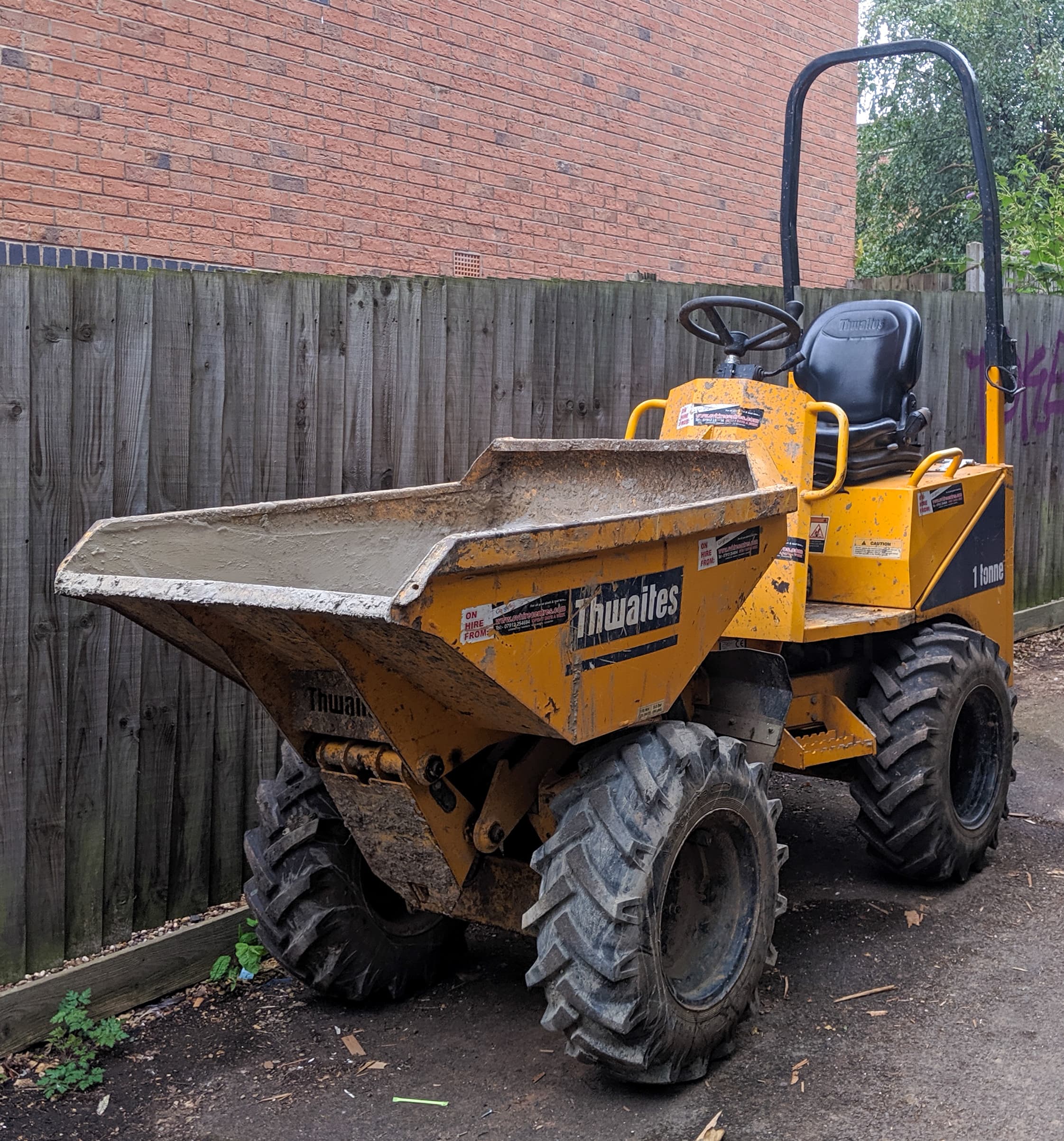 Yellow Thwaites 1-tonne dumper parked on site