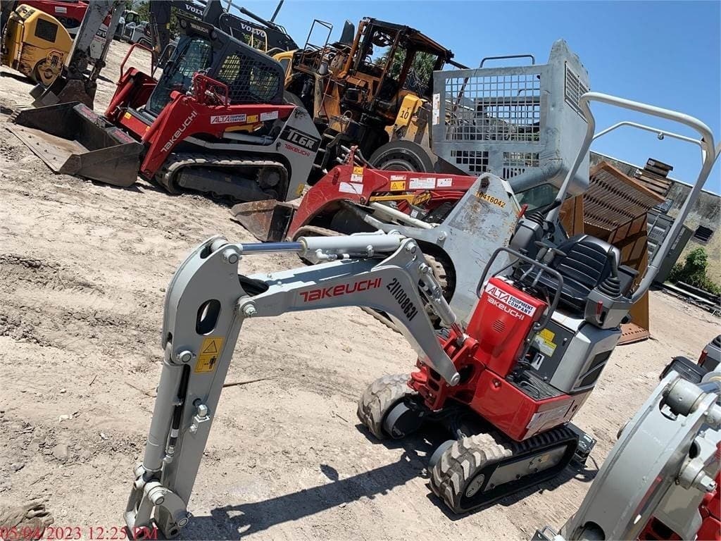 Takeuchi mini excavator sized for a residential access site